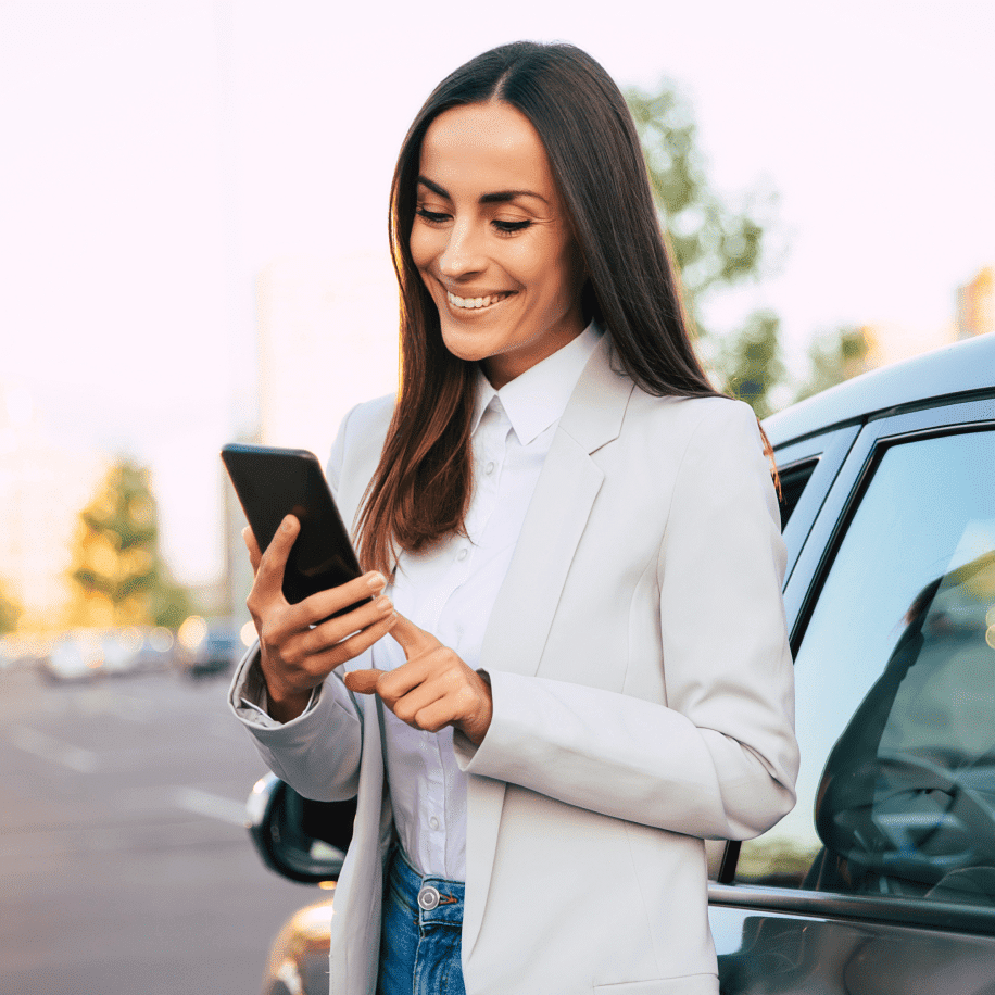 woman smiling looking at phone